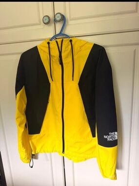 The North Face Yellow and Black Hooded Rain Jacket